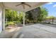 Covered patio with ceiling fan and views of a green, tree-filled yard at 410 Long Ave, Roxboro, NC 27573