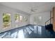 A bright sunroom features blue floors and natural light at 410 Long Ave, Roxboro, NC 27573