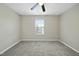 Bedroom with soft carpeting and natural light from a window at 413 Weeping Willow Dr, Durham, NC 27704
