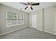 Bedroom with closet, window, and neutral colored walls at 413 Weeping Willow Dr, Durham, NC 27704
