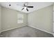 Bedroom with window and soft carpeting throughout the space at 413 Weeping Willow Dr, Durham, NC 27704