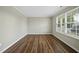Bright and airy bedroom with hardwood floors and neutral walls for versatile décor at 413 Weeping Willow Dr, Durham, NC 27704