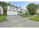 Attractive two-story house with a long drive, set against a backdrop of mature trees at 413 Weeping Willow Dr, Durham, NC 27704