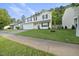 Traditional two-story home with lush green lawn, complemented by mature trees at 413 Weeping Willow Dr, Durham, NC 27704