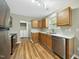Spacious kitchen boasts stainless steel appliances, ample storage and convenient laundry access at 413 Weeping Willow Dr, Durham, NC 27704