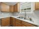 Detailed view of kitchen cabinetry, countertops, and stainless steel sink at 413 Weeping Willow Dr, Durham, NC 27704