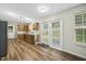Charming kitchen with stainless steel appliances, wood cabinets, and a view to the yard at 413 Weeping Willow Dr, Durham, NC 27704