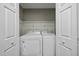 Bright laundry room with new appliances and ample storage space at 413 Weeping Willow Dr, Durham, NC 27704