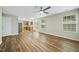 Open-concept area with hardwood floors, neutral walls, and abundant natural light at 413 Weeping Willow Dr, Durham, NC 27704