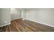 Spacious living room with hardwood floors, perfect for Gathering gatherings and relaxation at 413 Weeping Willow Dr, Durham, NC 27704