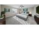 Relaxing main bedroom with a ceiling fan, large window, and an area rug at 413 Weeping Willow Dr, Durham, NC 27704