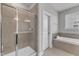 The bathroom has a shower, soaking tub, and towel rack at 4252 Rockdell Hall St, Raleigh, NC 27616