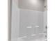 Clean white bathtub and shower combination at 4252 Rockdell Hall St, Raleigh, NC 27616
