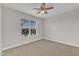 Bedroom offers a ceiling fan and bright window with view at 4252 Rockdell Hall St, Raleigh, NC 27616