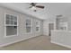 Spacious bonus room featuring carpet flooring, natural light and neutral colored walls at 4252 Rockdell Hall St, Raleigh, NC 27616