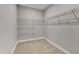 Walk-in closet with shelving and carpeted floor at 4252 Rockdell Hall St, Raleigh, NC 27616