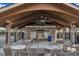 Community pavilion featuring a stone fireplace, ceiling fans, and seating, ideal for gatherings and socializing at 4252 Rockdell Hall St, Raleigh, NC 27616