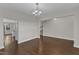 Spacious dining room with hardwood floors, a chandelier, and an open doorway at 4252 Rockdell Hall St, Raleigh, NC 27616