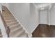 Elegant entryway featuring hardwood floors, a staircase, and a classic front door at 4252 Rockdell Hall St, Raleigh, NC 27616