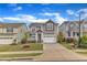 Inviting two-story house with manicured lawn, convenient garage, and charming front porch at 4252 Rockdell Hall St, Raleigh, NC 27616