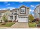 Attractive two-story house featuring an attached garage, manicured lawn and inviting porch at 4252 Rockdell Hall St, Raleigh, NC 27616