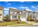 Beautiful two-story home with a green lawn, complemented by a yellow fire hydrant on a sunny day at 4252 Rockdell Hall St, Raleigh, NC 27616