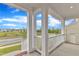 Spacious front porch with white railings and columns, offering serene neighborhood views at 4252 Rockdell Hall St, Raleigh, NC 27616