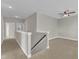 Hallway with carpeted floors and a view into other rooms of the house at 4252 Rockdell Hall St, Raleigh, NC 27616