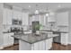Kitchen with granite countertops, stainless appliances, and white cabinets at 4252 Rockdell Hall St, Raleigh, NC 27616