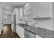 Modern kitchen featuring stainless steel appliances, granite countertops, and white subway tile backsplash at 4252 Rockdell Hall St, Raleigh, NC 27616
