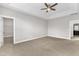 Spacious main bedroom features a tray ceiling, ceiling fan, and connects to both a closet and bath at 4252 Rockdell Hall St, Raleigh, NC 27616