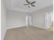 This carpeted main bedroom features an ensuite bathroom and walk in closet at 4252 Rockdell Hall St, Raleigh, NC 27616