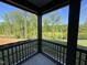 View from a covered patio of the lush green backyard and mature trees at 4404 Darius Ct # 41, Fuquay Varina, NC 27526