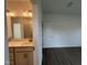 Bathroom featuring a vanity with storage, modern lighting, and a view into the shower at 4404 Darius Ct # 41, Fuquay Varina, NC 27526