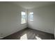 Bedroom featuring neutral carpet, white walls, and two windows for plenty of natural light at 4404 Darius Ct # 41, Fuquay Varina, NC 27526