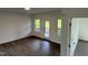 Bright bedroom features wood floors, a door to the outside, and two windows for ample natural light at 4404 Darius Ct # 41, Fuquay Varina, NC 27526