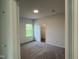 This carpeted bedroom boasts neutral paint and a window offering plenty of natural light at 4404 Darius Ct # 41, Fuquay Varina, NC 27526