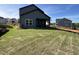 View of the new construction home's back patio and grassy backyard at 4404 Darius Ct # 41, Fuquay Varina, NC 27526