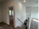Upstairs hallway featuring neutral carpet, white walls, and access to stairs and bedrooms at 4404 Darius Ct # 41, Fuquay Varina, NC 27526