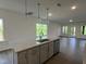 Stylish kitchen island with sink, dishwasher, and pendant lighting in a bright, open space at 4404 Darius Ct # 41, Fuquay Varina, NC 27526