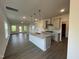 Modern kitchen with stainless steel appliances and an island overlooking the living room at 4404 Darius Ct # 41, Fuquay Varina, NC 27526