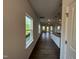 Bright living room featuring hardwood floors and natural light from the window at 4404 Darius Ct # 41, Fuquay Varina, NC 27526