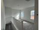 Upstairs loft area featuring new carpet, neutral paint, and natural light from two windows at 4404 Darius Ct # 41, Fuquay Varina, NC 27526