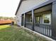 View of the covered back patio with black railings, posts and green yard at 4404 Darius Ct # 41, Fuquay Varina, NC 27526