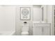 A bathroom featuring white cabinets, shower and tub combination and modern fixtures at 472 Carolina Springs Blvd, Apex, NC 27539