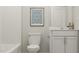 A bathroom featuring white cabinets, shower and tub combination and modern fixtures at 472 Carolina Springs Blvd, Apex, NC 27539