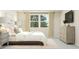 Spacious bedroom offering a serene retreat with a cozy bed, bedside table, and a large window providing natural light at 472 Carolina Springs Blvd, Apex, NC 27539