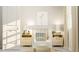 A cozy Bedroom with a white crib, matching side tables, and playful decor at 472 Carolina Springs Blvd, Apex, NC 27539