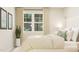 A serene bedroom with a large window, light drapes, and stylish decor at 472 Carolina Springs Blvd, Apex, NC 27539
