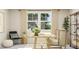 Bright home office featuring a wooden desk with stylish décor, a comfortable chair, and large windows bringing natural light at 472 Carolina Springs Blvd, Apex, NC 27539